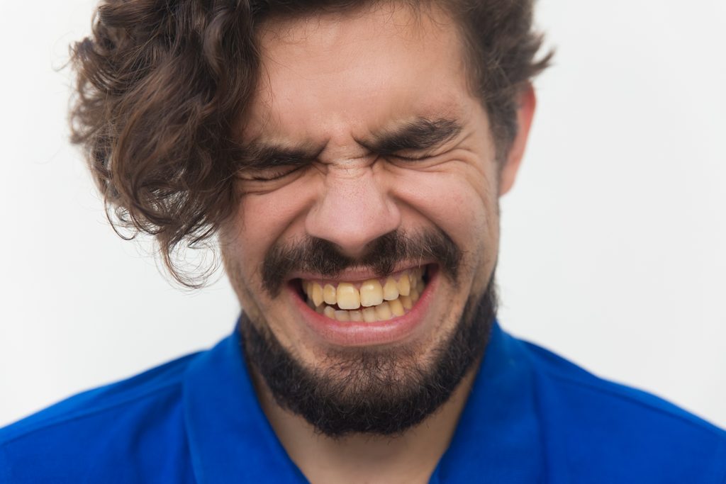 closeup stressed unhappy male face